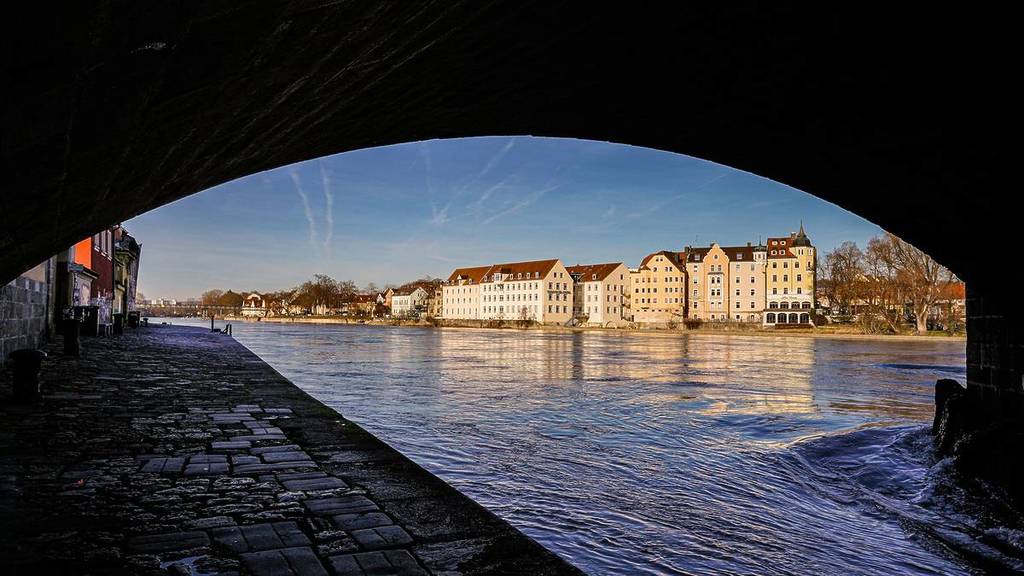 view of regensburg through the bridge arch