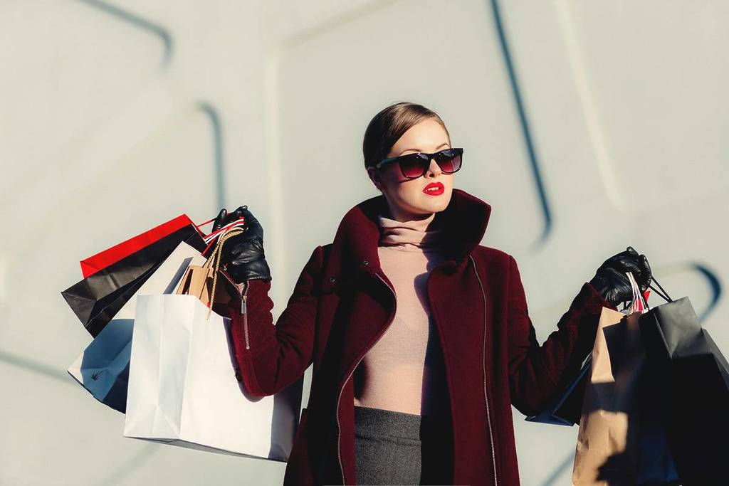 Woman with shopping bags in hand