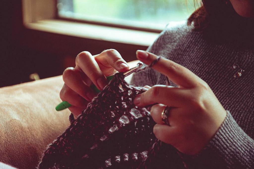 woman crocheting