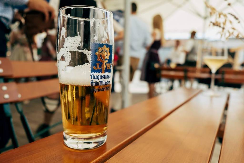 Augustiner Bräu in a glass in a beer garden, strong beer festivals in Munich