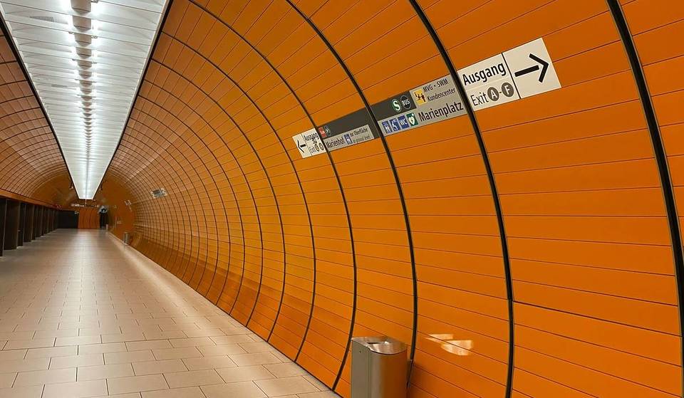 23 meters underground, Munich’s busiest subway station glows in orange and red: Here’s the story behind the unconventional design