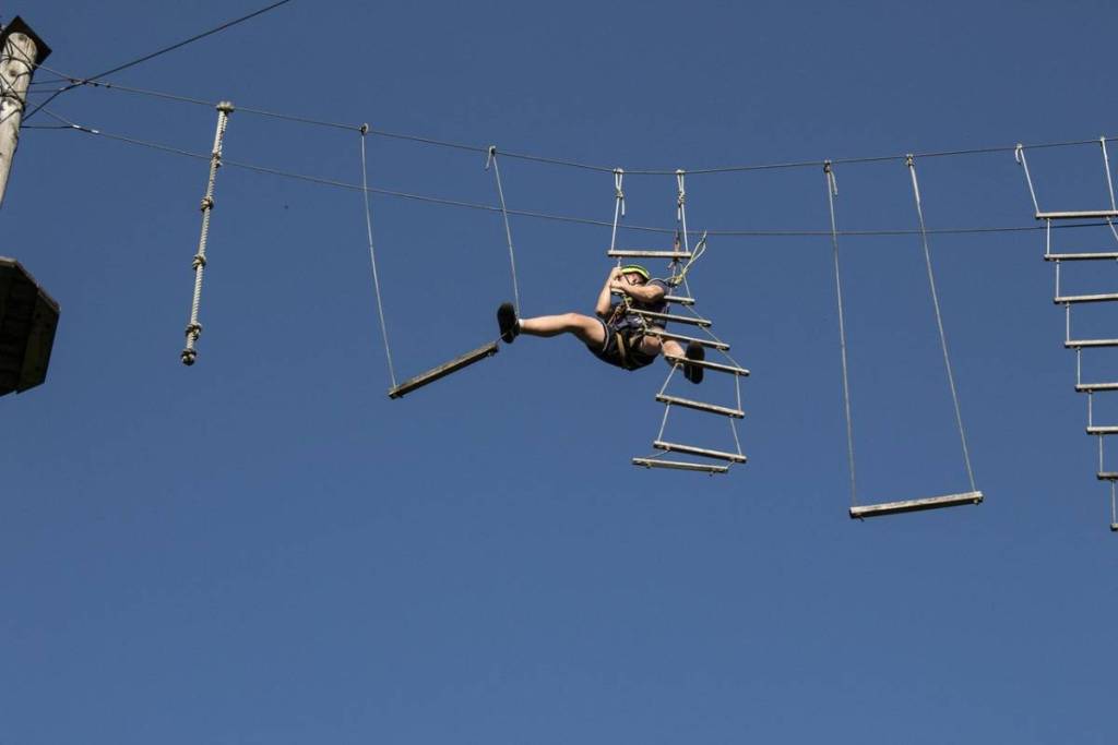 A person climbs on a climbing course