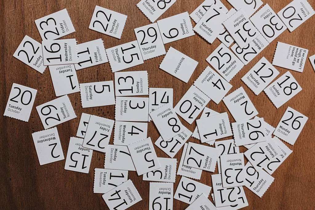 calendar pages scattered in disarray on the floor