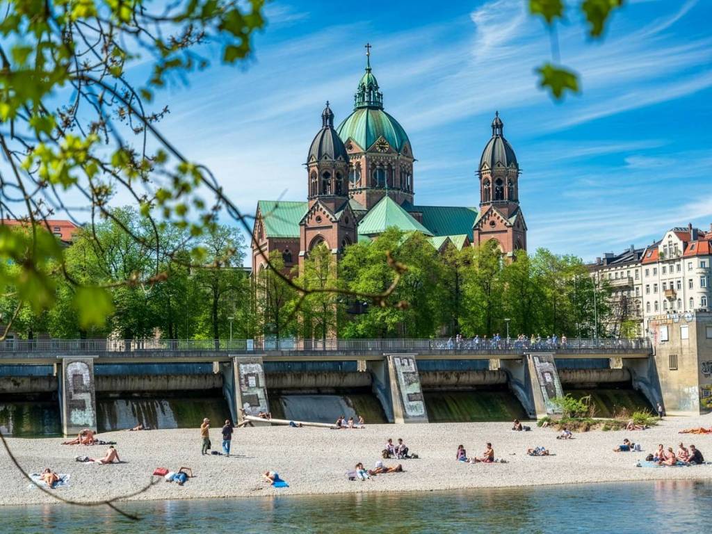 The Isar with a church in the background, bathed in sunlight