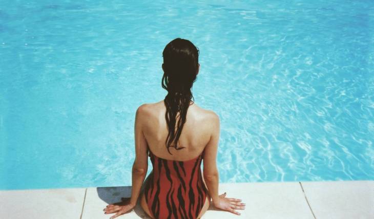 Swimming pool meets beach club: At this idyllic Munich outdoor pool, you can relax on 540 metric tons of golden sand or zoom down the 50-meter slide into the cool water