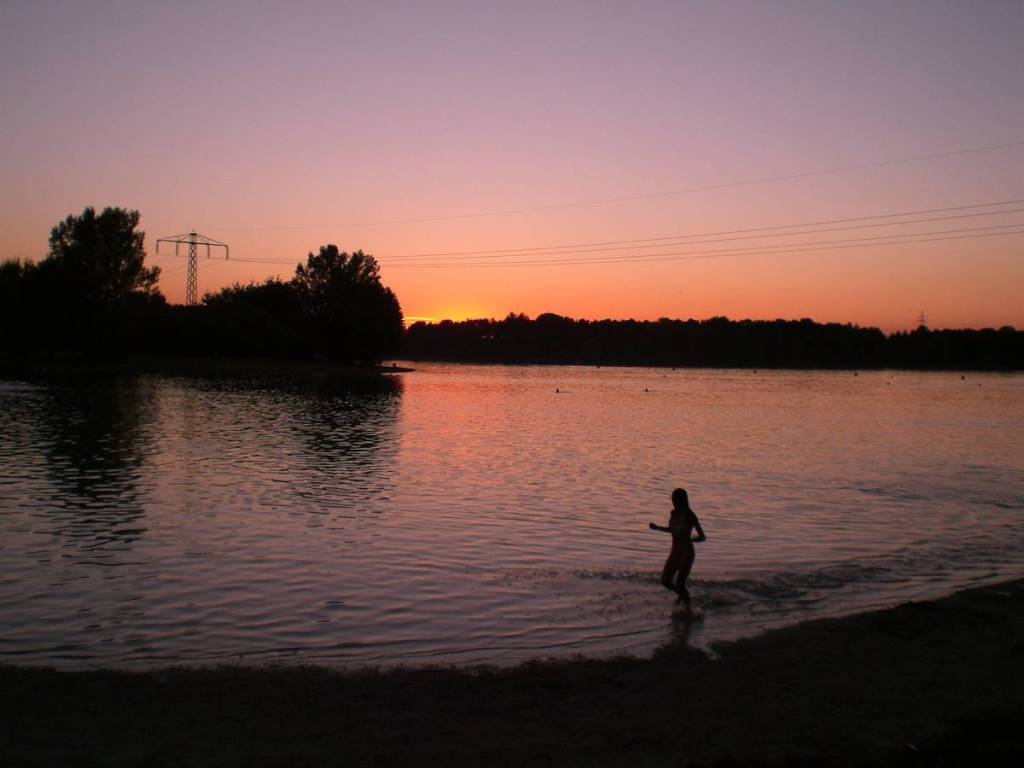 Feringasee at sunset with a swimmer