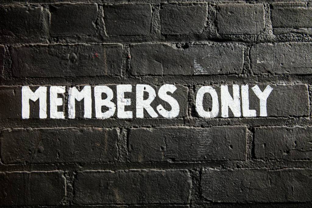 wall with “Members Only” sign