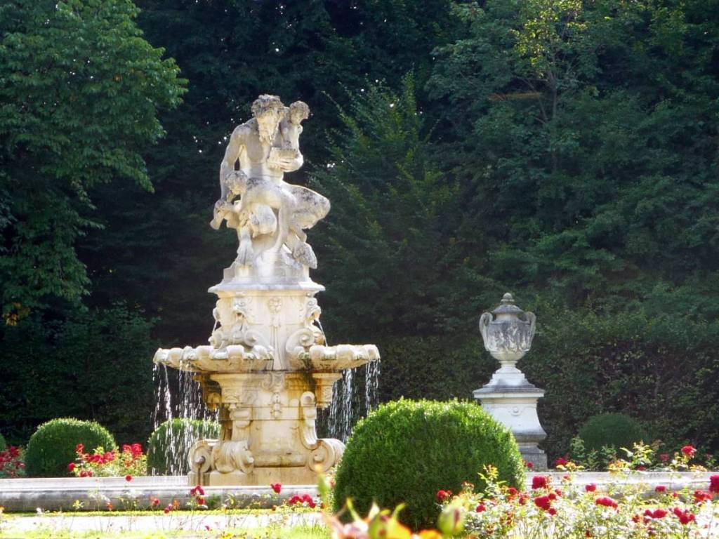 Fountain with a faun sculpture in the palace garden