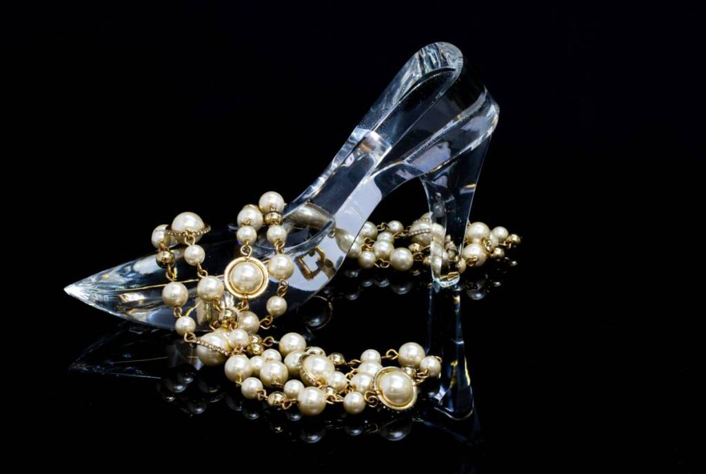 glass shoe and pearl necklace
