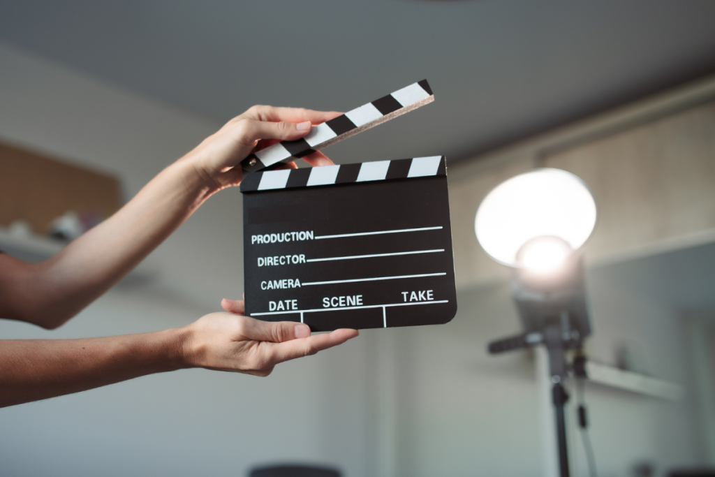 Person holding a clapperboard