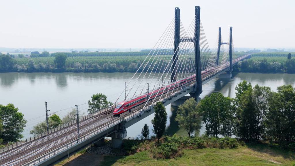 Frecciarossa train crosses a bridge