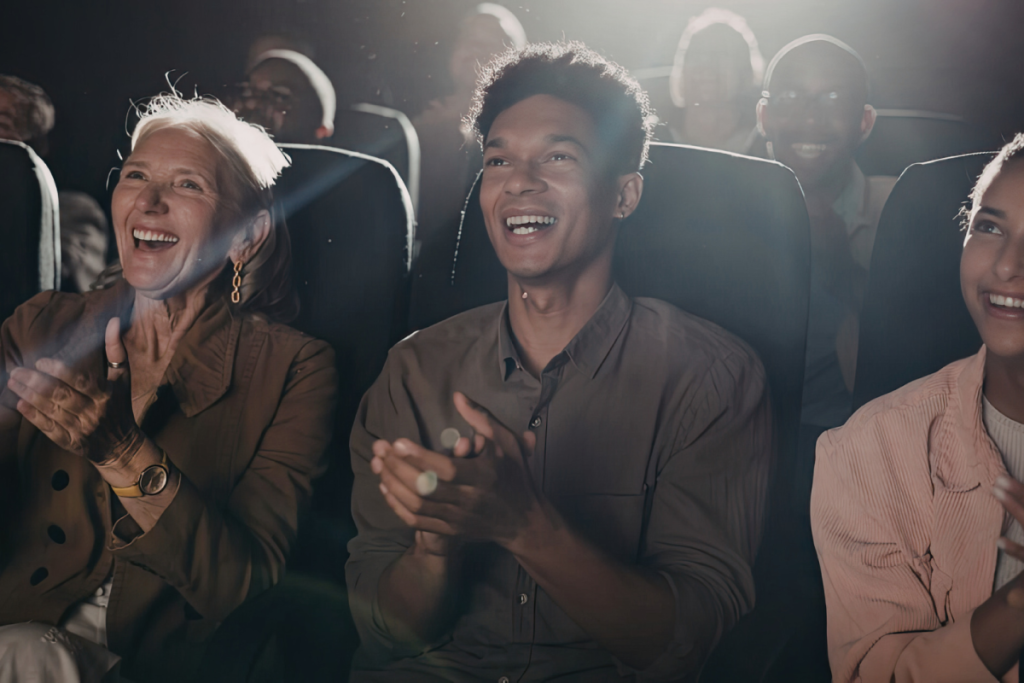 People clapping in the movie theater