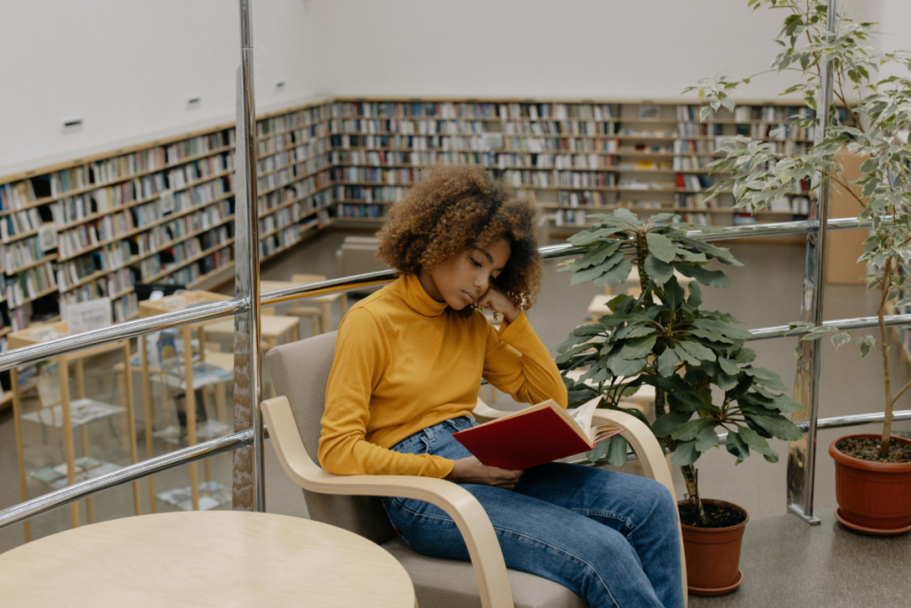 A girl reading in a library