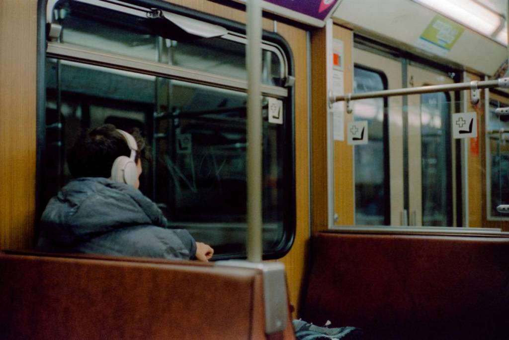 A person is sitting in a Munich subway car