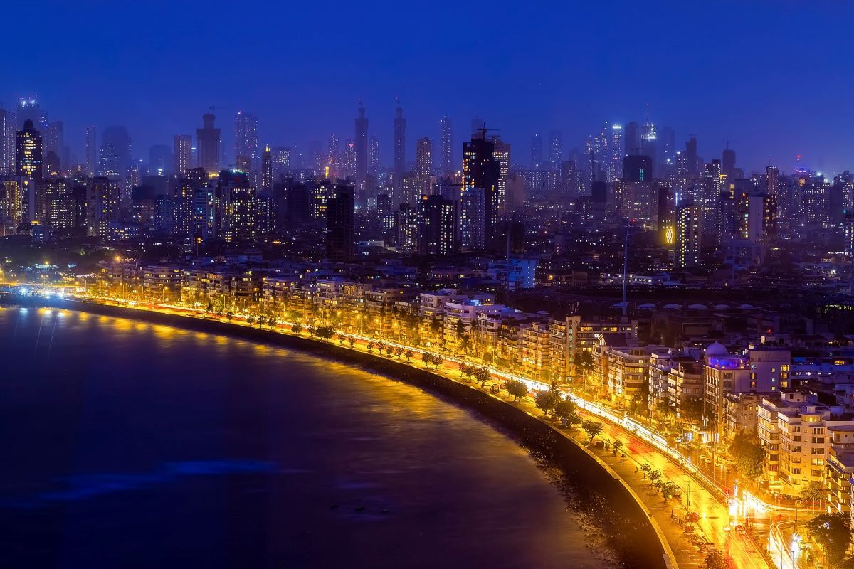 Marine Drive in Mumbai lit up at night, showcasing its length and beauty