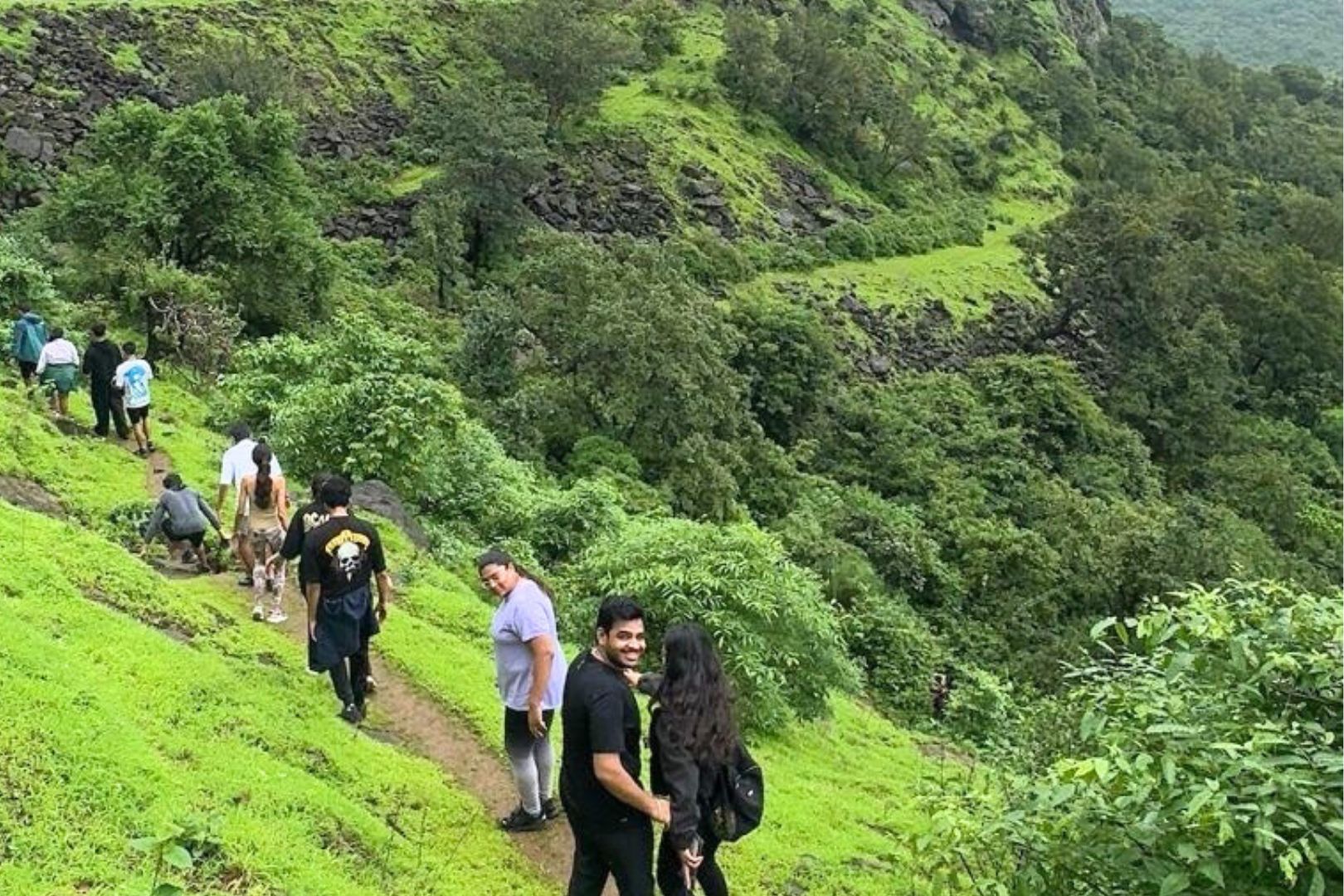 People trekking through the sahyadris in Lonavala - this guided treak is one of the best things to do in Mumbai this weekend