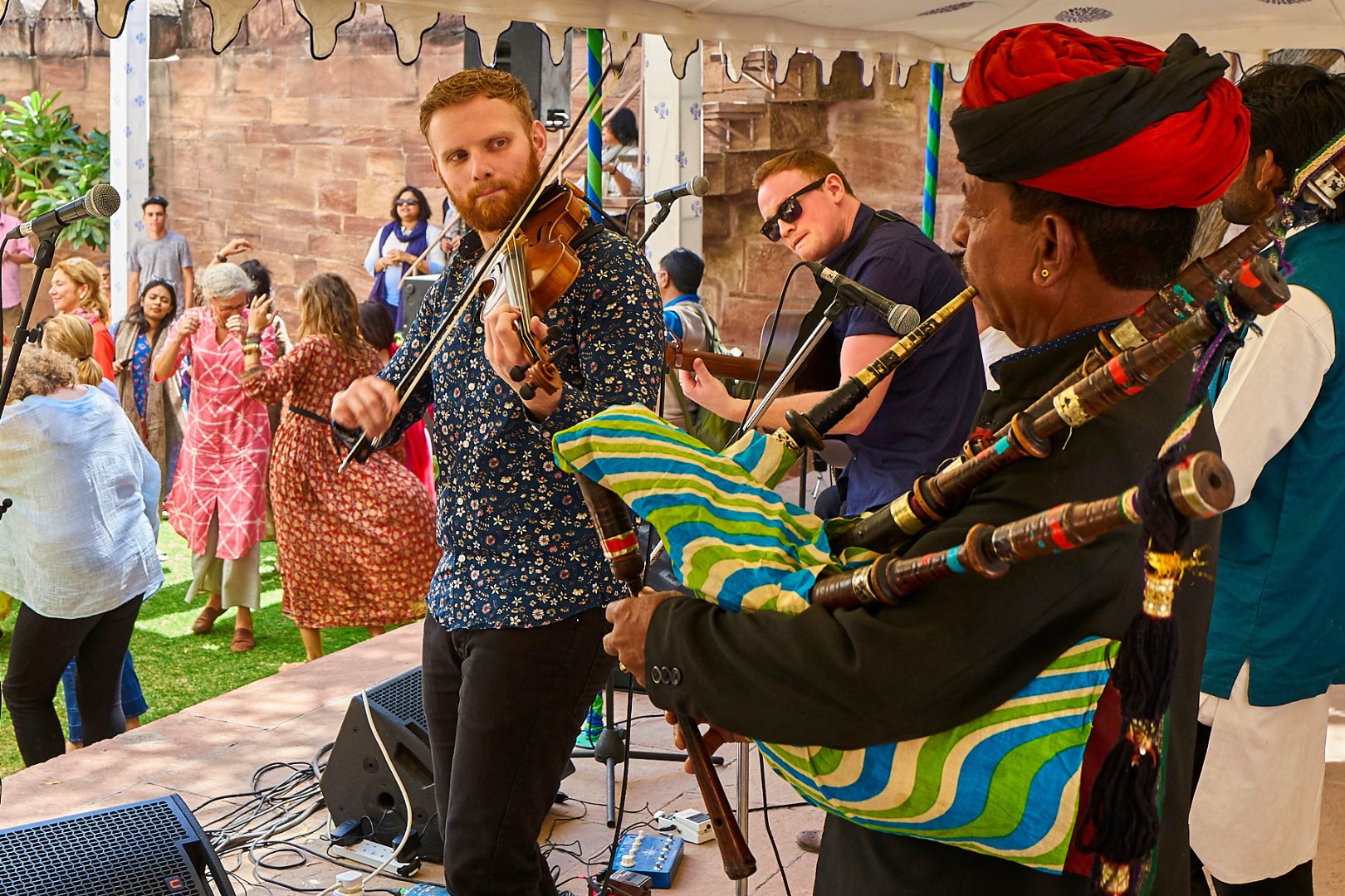 A group of performers playing a variety of instruments