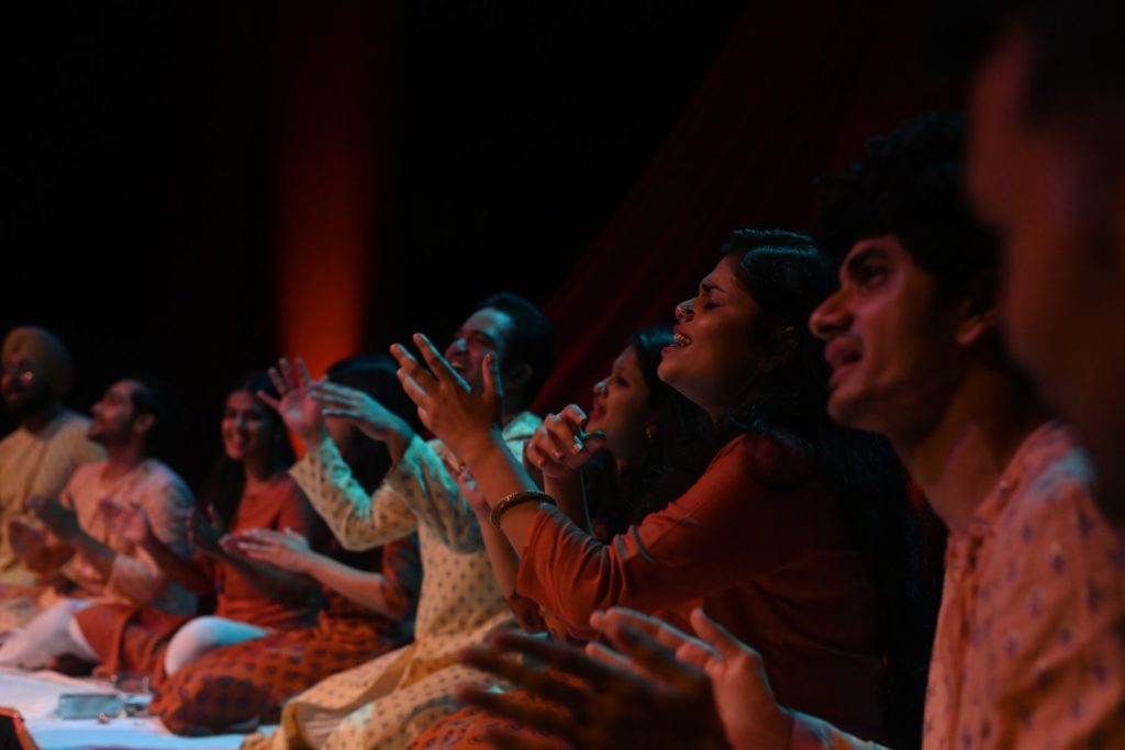 A close up shot of the cast on stage
