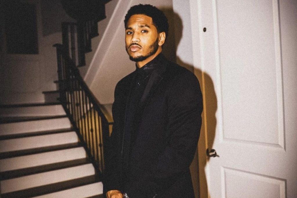 Trey Songz stood in front of a door and staircase
