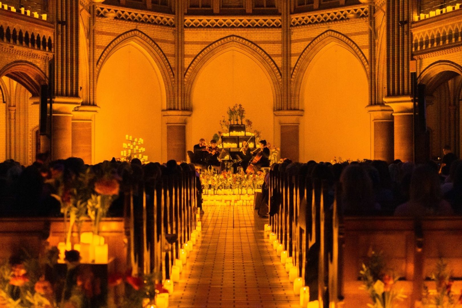 A candlelight concert taking place in an elegant venue