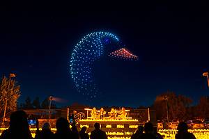 Illuminated drones take flight over a string quartet