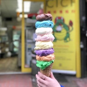 Person holding multi-layered ice cream