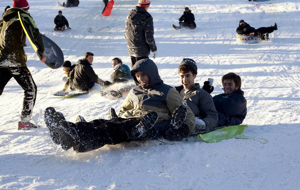 NEW YORK, NEW YORK - FEBRUARY 9: People enjoy sled riding in Central Park one day after snow storm Nemo. Taken February 9, 2012 in NYC.