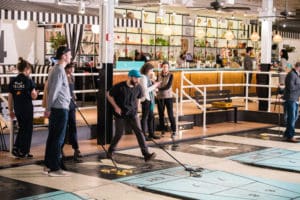 People playing shuffleboard at Royal Palms Shuffleboard in Brooklyn, NY