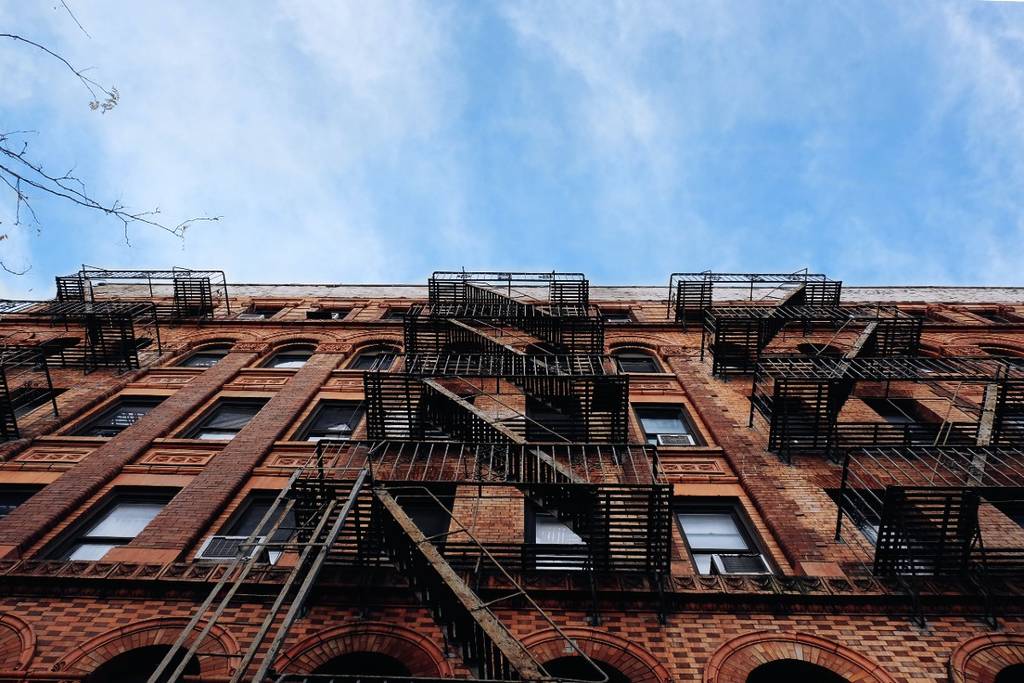 Looking up at a NYC apartment building