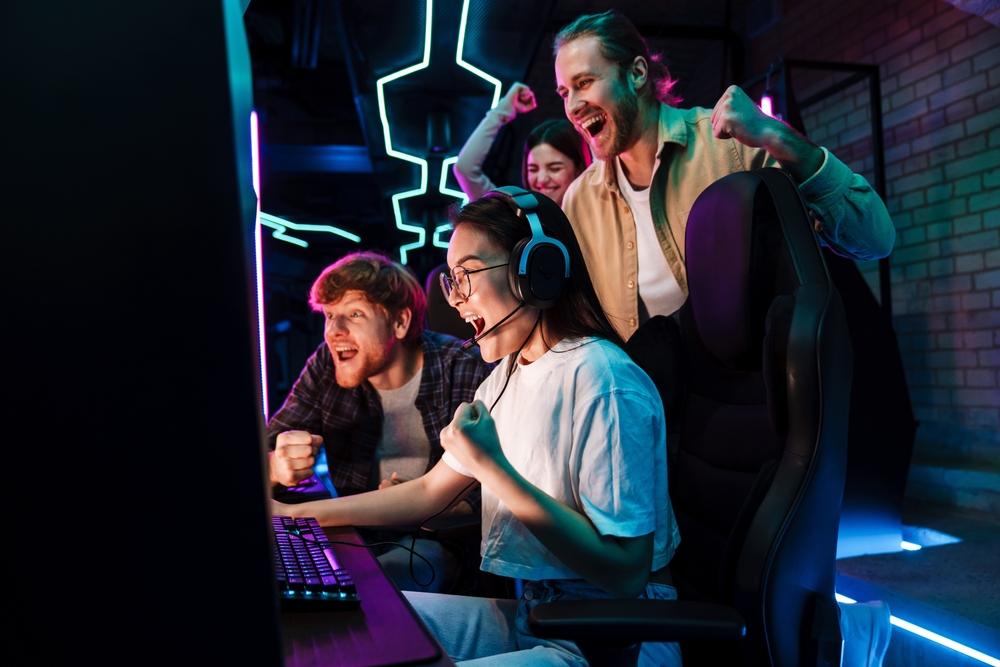 Friends playing a video game with neon lights