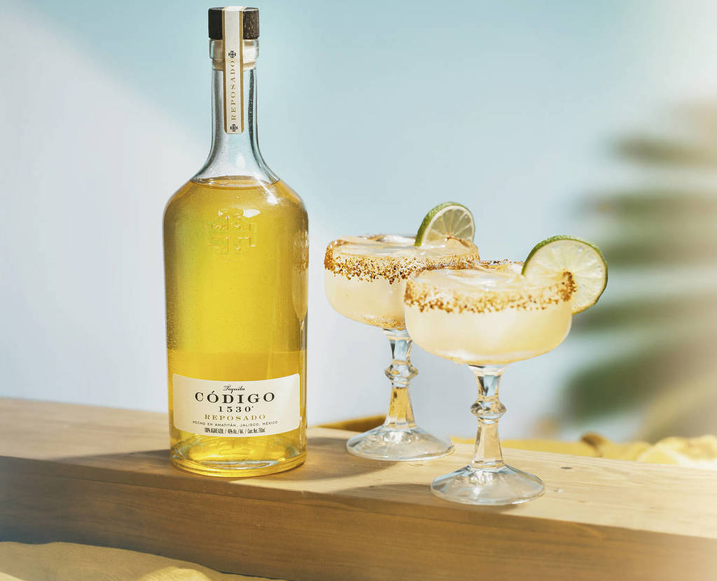 Codigo maragaritas with a bottle of tequila.