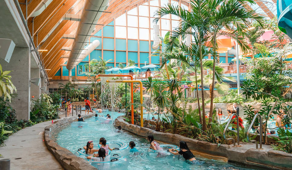 The largest glass-domed waterpark in New York is just 2 hours from NYC — with the state’s longest indoor lazy river, high-thrill slides, a continuous surf wave, and so much more