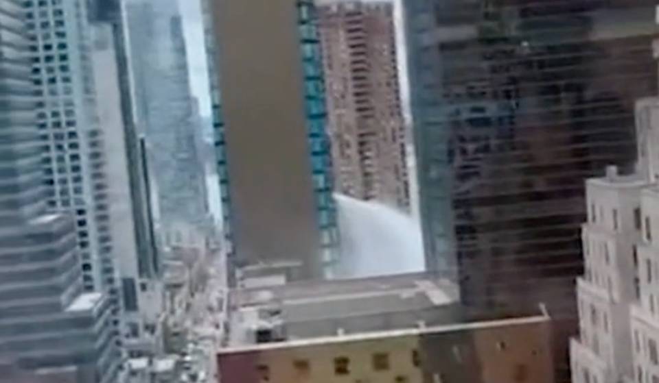 Gushing Water Spouts From The Side Of A Manhattan High-Rise