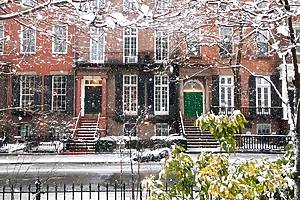 Snow covered streets and sidewalks along Washington Square Park during a winter storm in New York City NYC