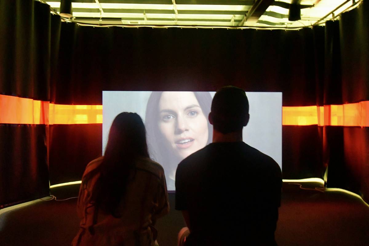 People watching something on screen
