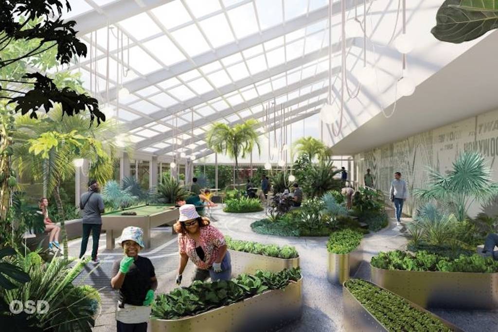 Former JFK Hilton Hotel redesigned as an affordable housing unit in a rendering of a communal indoor garden space