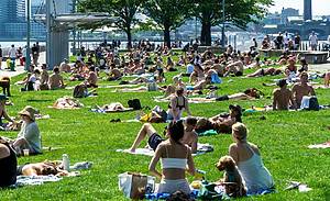 People on the lawn at the Christopher Street Pier in Hudson River Park