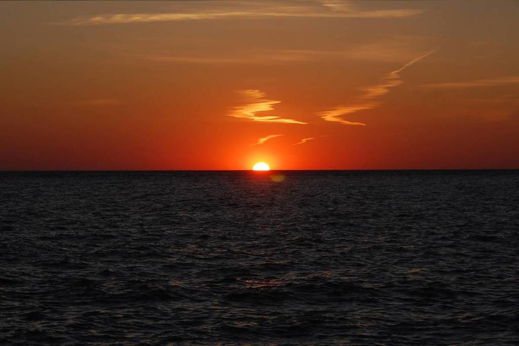 The Beach With The Best Sunsets In The Country Is Near NYC–& Its Sand Is Filled With Sparkling Crystals