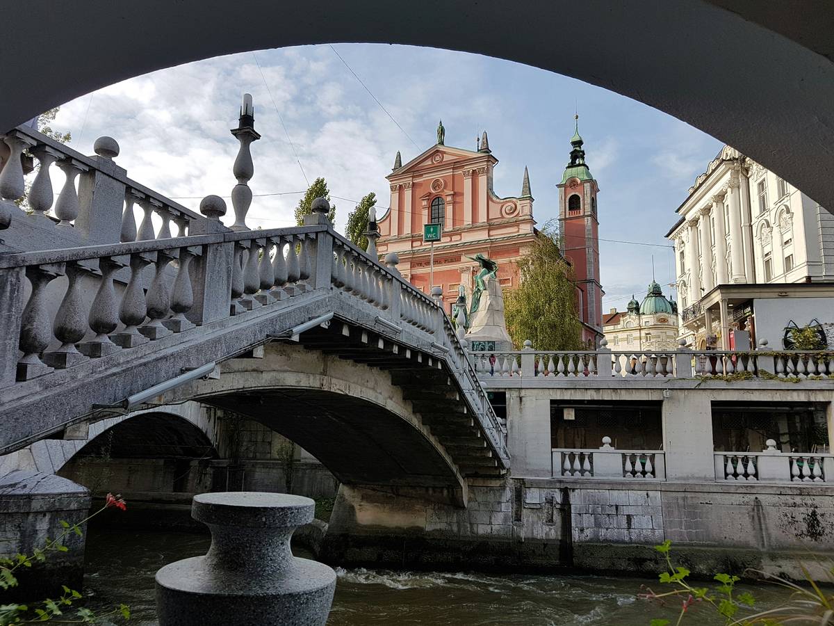 Pink church and one of the three bridges in downtown Ljubljana