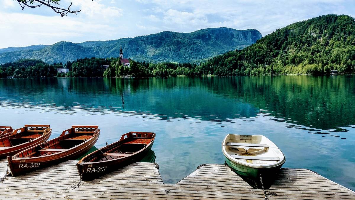 Boats docked in Lake Bled