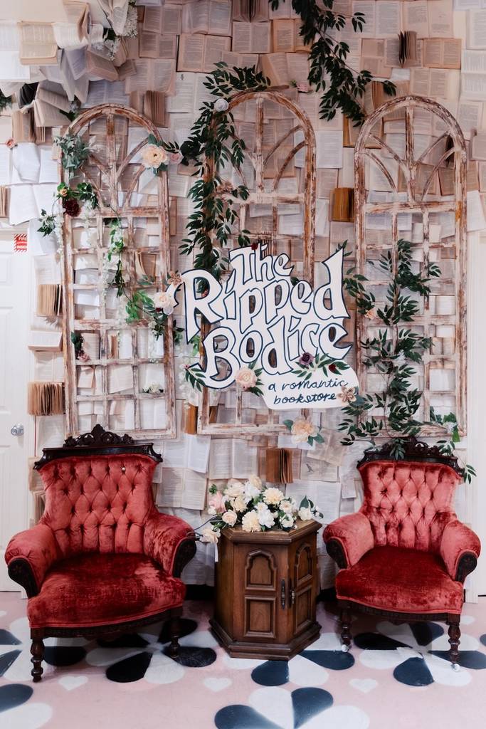 Ripped Bodice interior decor with red velvet chairs