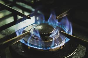 stove burner lit with a flame