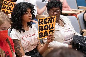 Brooklyn, New York, USA. 15th June, 2023. People gather holding signs in protest in St. Francis College as the NYC Rent Guidelines Board holds a hearing on rent hikes.