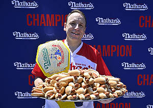 Nathan’s Fourth of July Hot Dog contest.Monday, July 4th 2022. Joey “JAWS” Chestnut wins Men’s competition with 63 hot dogs and buns in 10 minutes while the women’s title is reclaimed by Miki Sudo with 40 hot dogs and buns in 10 minutes. The 106th annual Nathan’s Famous Fourth of July International Hot Dog eating contest is back to its original location outside the Nathan’s on Stillwell and Surf avenues in Coney Island, after being forced to Maimonides Park near by last year due to COVID-19 pandemic. The defending Men’s champion and the world record holder Joey “JAWS” Chestnut and the Women’s champion Michele Lesco are back. Also making her comeback after last year pregnancy is Women’s world record holder Miki Sudo. About 20-25K fans are expected to attend. The Women’s contest kicks-off at 11AM, while the Men’s contest starts at 1PM, both live on ESPN.