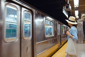 Young tourist waiting for a train in the subway in New York City