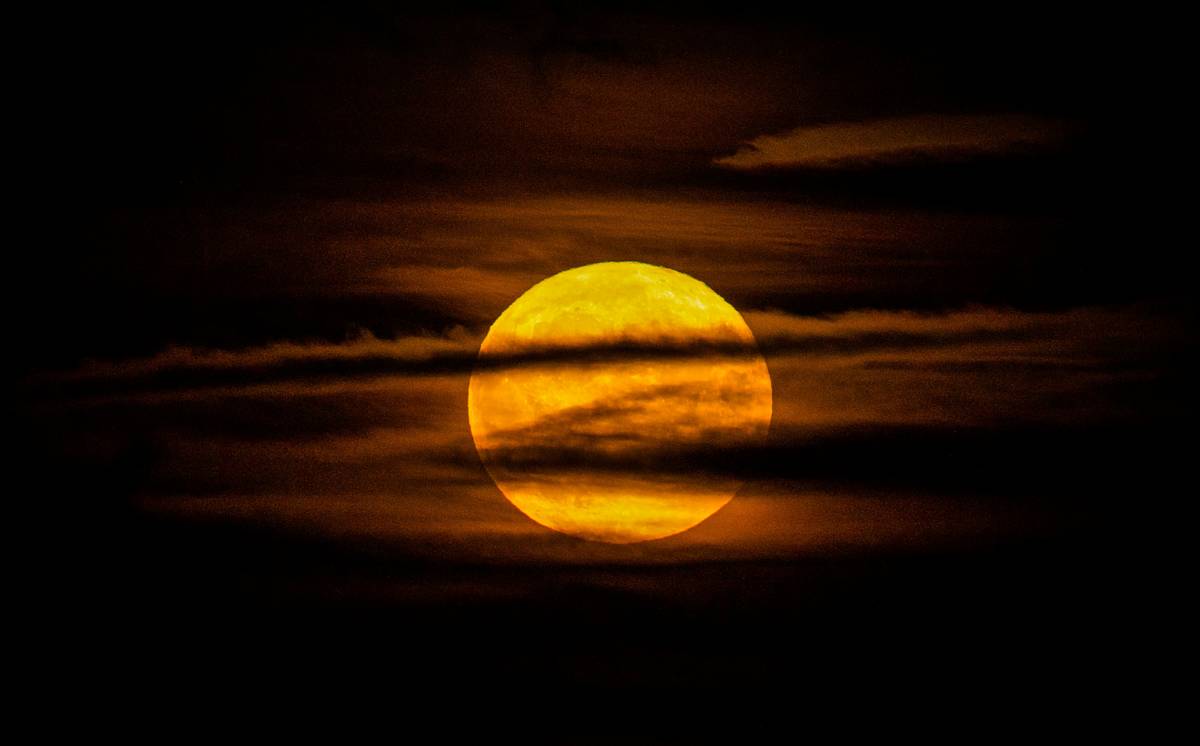 Full moon with clouds in front of it