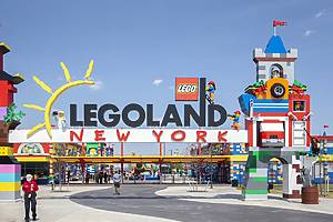 Brooklyn, NY - April 24 2021: Visitors pass through the colorful entrance gate to Legoland in New York. Lego building blocks