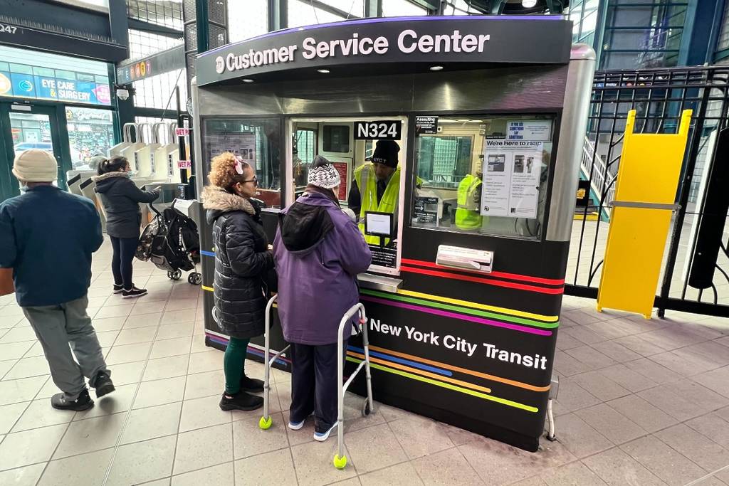 MTA Customer Service Center with two elderly women getting assistance