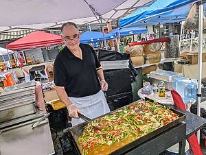 man cooking food at Ferragosto Festival
