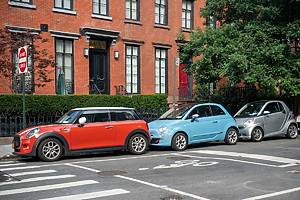 New York NY USA-August 23, 2022 A Mini Cooper, manufactured by BMW, a Fiat, manufactured by Stellantis and a Smart Car, manufactured by Daimler, all lined up in a row